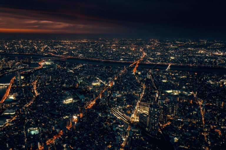 Where to Stay in Tokyo (Best Areas + Hotels for Every Budget) Breathtaking aerial cityscape of Tokyo, Japan, illuminated at night with vibrant urban lights.